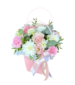 Poseta arrangement of pink & white flowers for school
