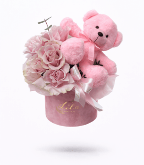 Box of pink flexati roses and teddy bear